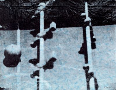 a black and white photo of a bunch of skis in the snow