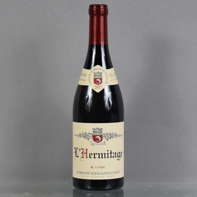 a close up of a bottle of wine on a table