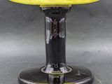 an image of a yellow glass vase on a black base