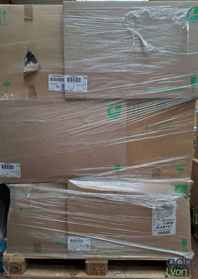 a pallet full of boxes with plastic wrap on it