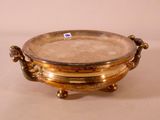 an image of a gold plate with handles on a white surface