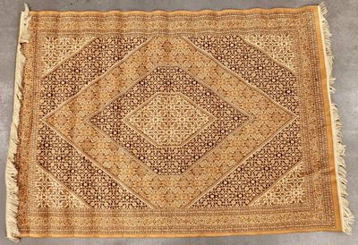 an antique rug with a diamond design and fringe fringes