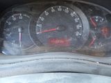 a close up of a car dashboard with a speedometer and gauges