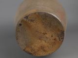 an old baseball bat with a wooden handle sitting on a table