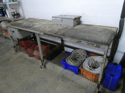 a workbench with a bunch of tools on it