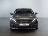 the front view of a grey car in a showroom