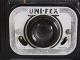 a close up of an old camera with a lens on it