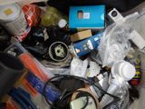 a pile of assorted items in a trash can