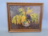 painting of yellow and purple flowers in a vase on a table
