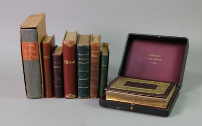 many books that are sitting in a box on the table