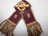 an image of a scarf with a gold horse on it