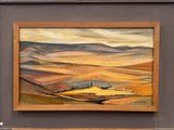 tableau à l'huile encadré représentant un paysage avec des collines au loin