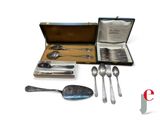 a silverware set in a case with spoons and spoon spoons