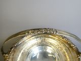 a silver plate that is sitting on a table