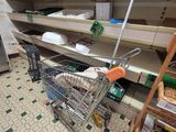 a shopping cart that is sitting in the middle of a store