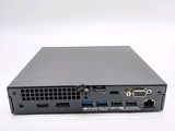 the back view of a small computer with two ports on it