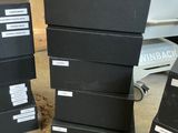 four boxes stacked on top of each other on the floor