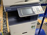 an image of a multi - function printer sitting on top of a table