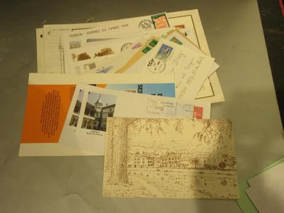 a pile of letters and envelopes on a table