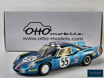 the model of a blue race car sits in front of a box