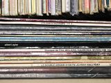 a lot of cds stacked on top of each other