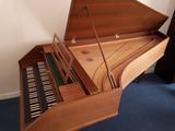 a piano that is sitting on the floor in a room