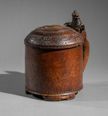 an old wooden teapot with a bird on top of it
