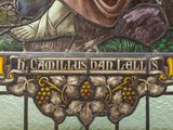 a stained glass window with a picture of a woman holding a baby