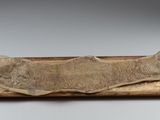 an image of a piece of wood with a fish head on it