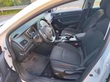 the interior of a car with the door open and the passenger seat down