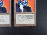 two cards with a picture of a demon on them