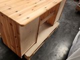 a wooden table that is sitting in the middle of a room