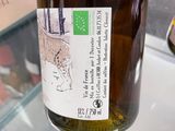 a bottle of wine that is sitting on a counter