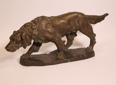 bronze statue of a dog on a wooden base on a white background