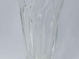 a clear glass vase on a white surface