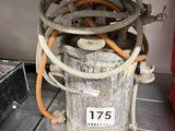 a bucket with a hose attached to it on a table
