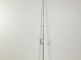 a tall pole with a sign on it in a room