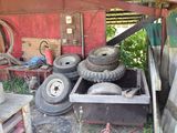 a pile of old tires and other junk in a garage