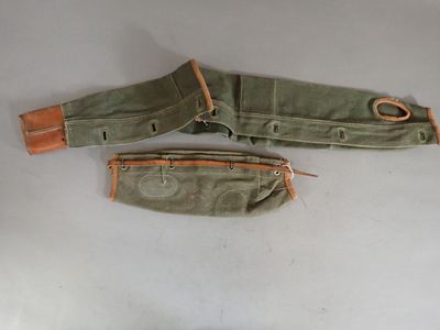 two pieces of military equipment on a white surface