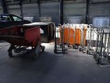 many carts that are lined up in a garage
