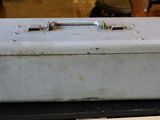 a metal box sitting on top of a wooden box