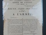 an old newspaper advertises the arrival of the army in france