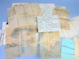 a pile of old papers on a blue surface