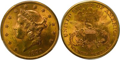 a close up of two gold coins on a white background