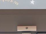 a sign on the door of a building that says chez nous en la paque