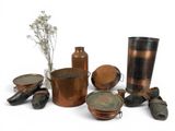 many different types of copper pots and pans