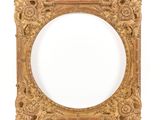 an old gold frame with ornate carvings and a white background