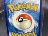 a plastic box with a pokemon card inside of it