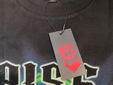 a black t shirt with a green and red design on it