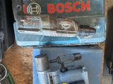 a blue box with a tool on top of it next to other tools